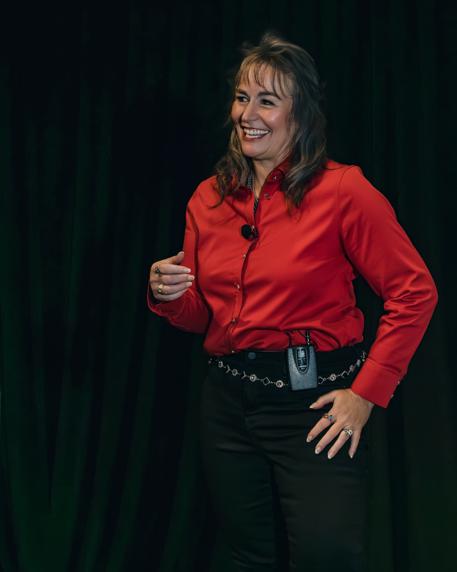 Kate Woodward Young speaking in a red blouse